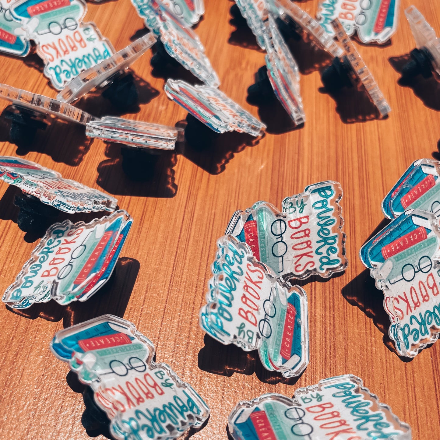 Powered by books l acrylic pins