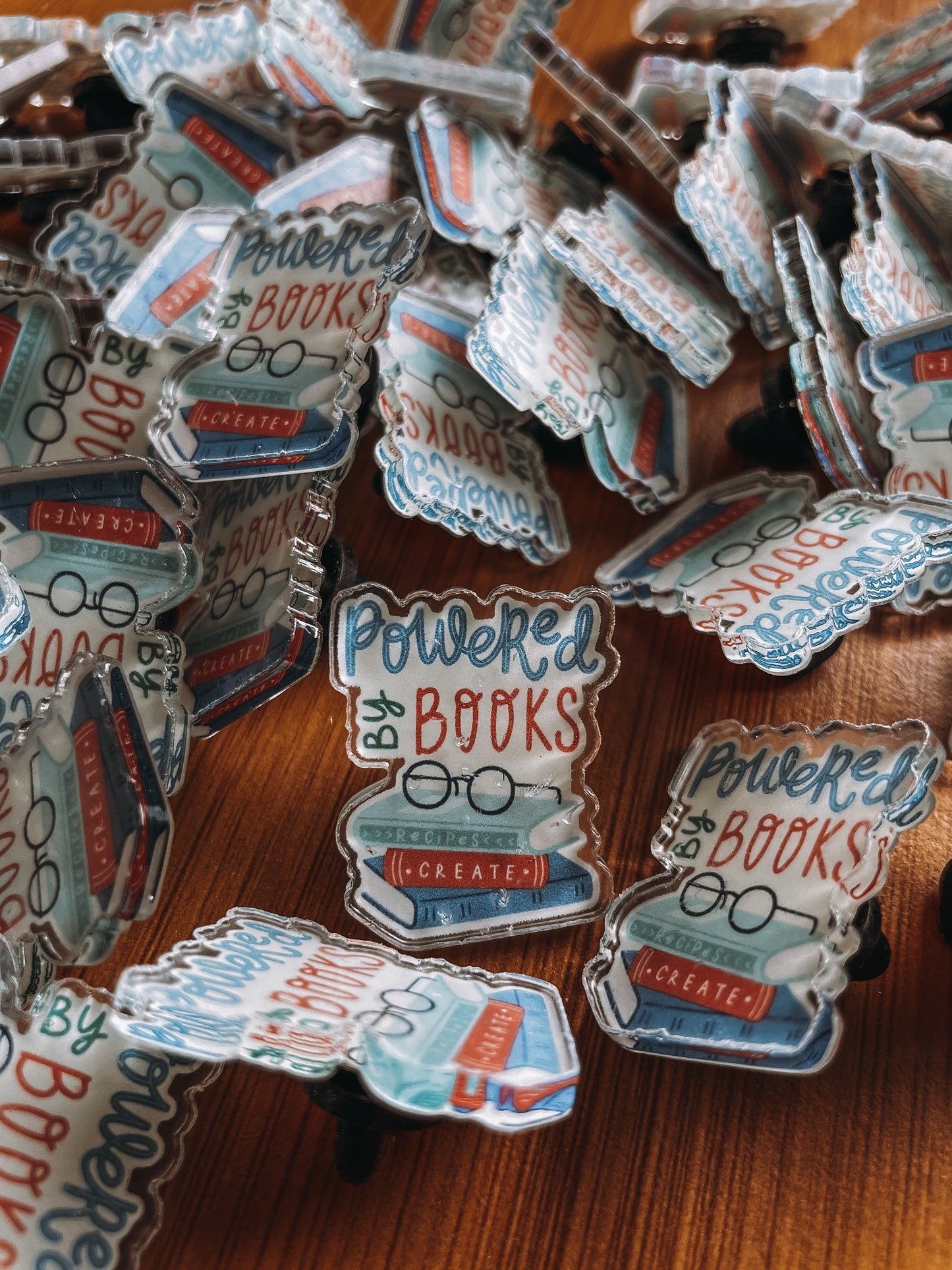 Powered by books l acrylic pins